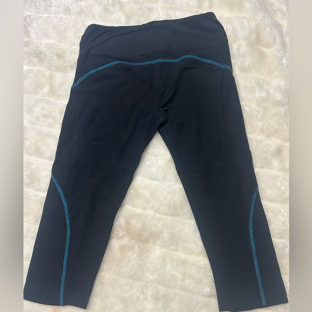 Black mid-calf leggings with turquoise